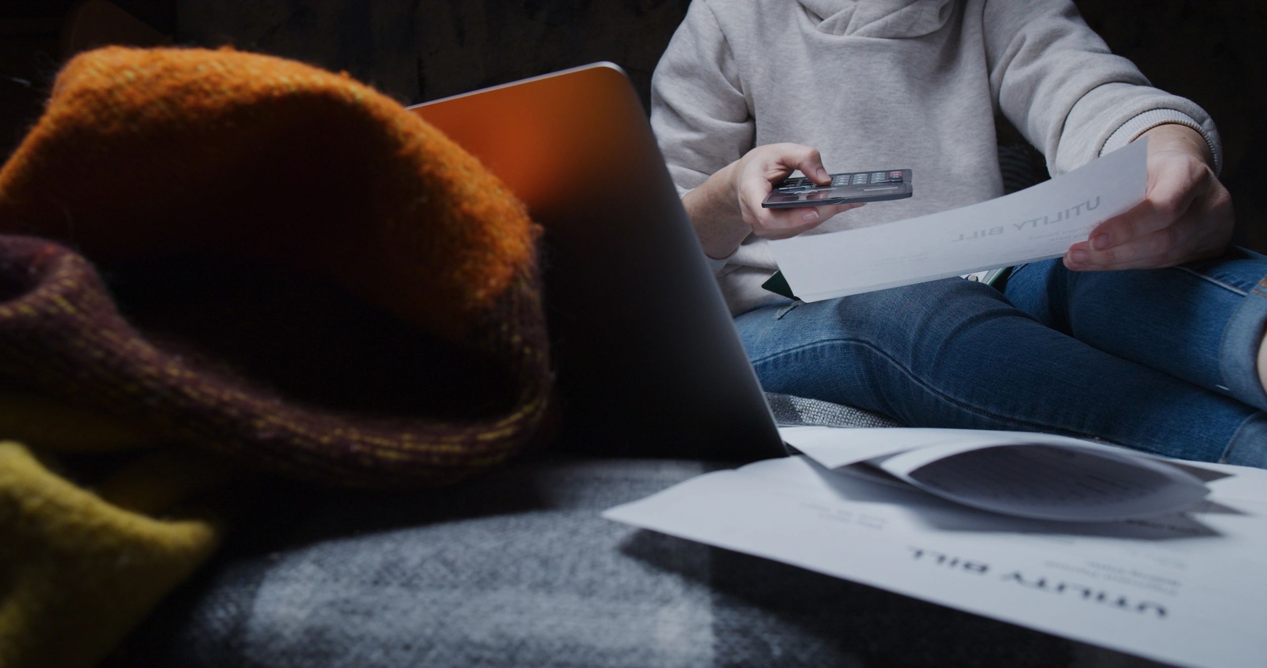 Woman reviewing household finances while planning a car payment