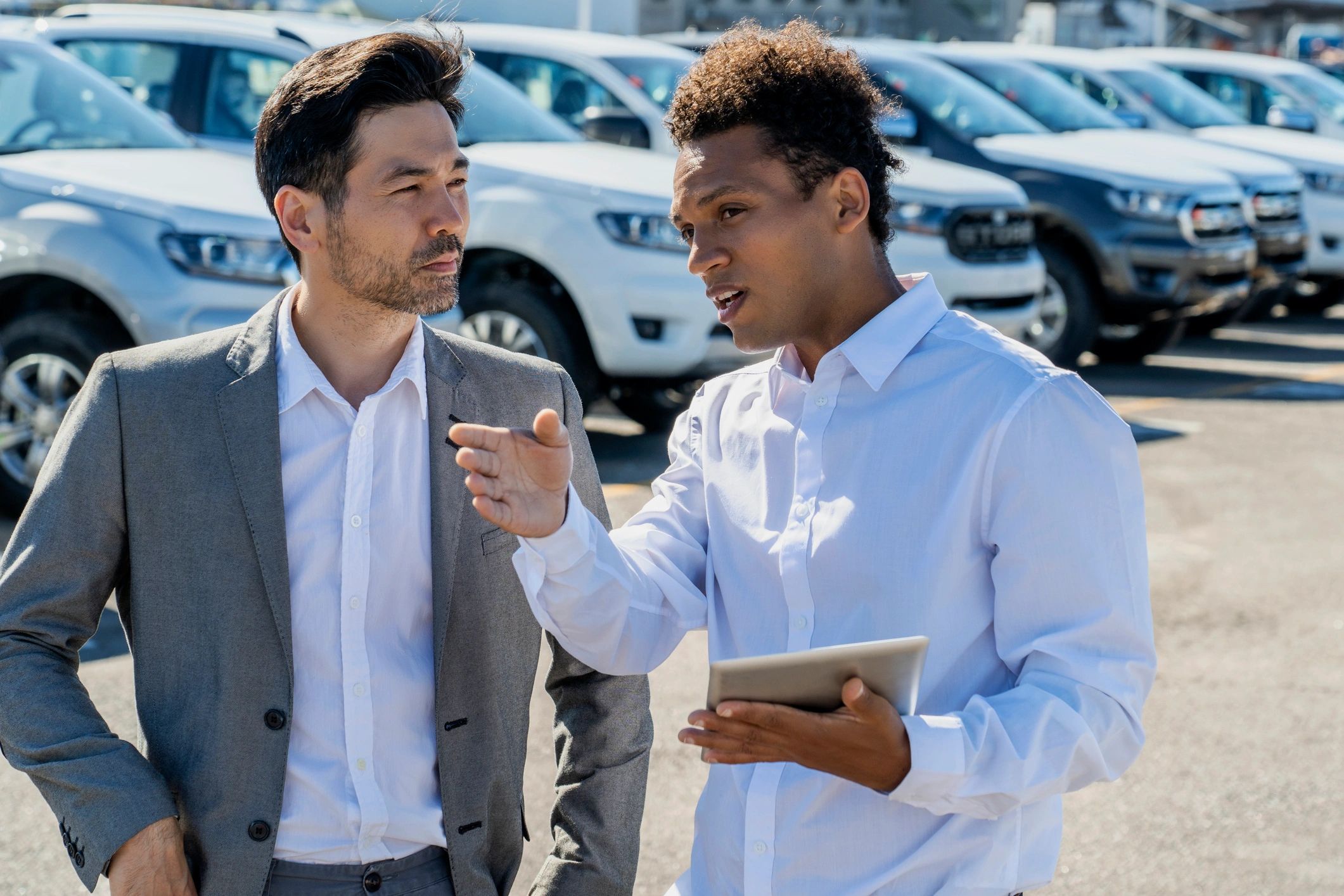 Car buyer reviewing financing details with a dealership professional