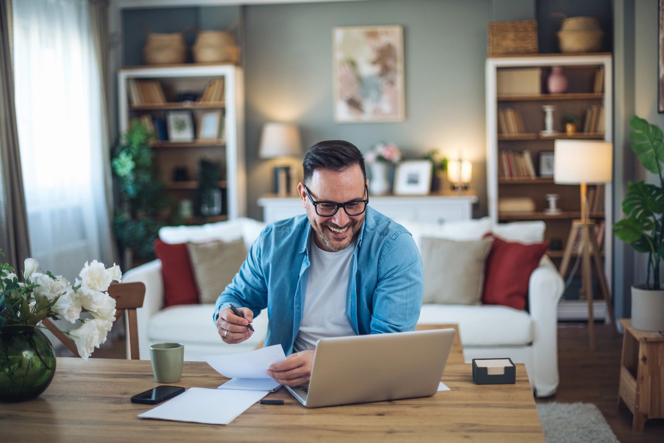 Person reviewing finances on a laptop at home