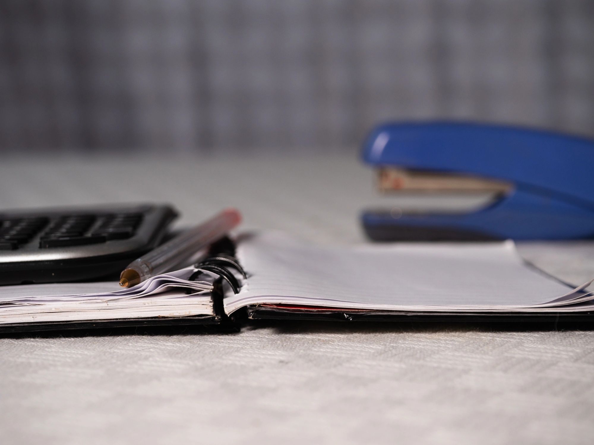Calculator and paperwork on a desk
